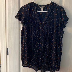 Navy top with golden flowers
